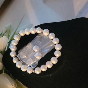 New sterling silver and genuine cultured pearl necklace with matching earrings.